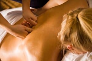 woman at a day spa getting a deep tissue massage