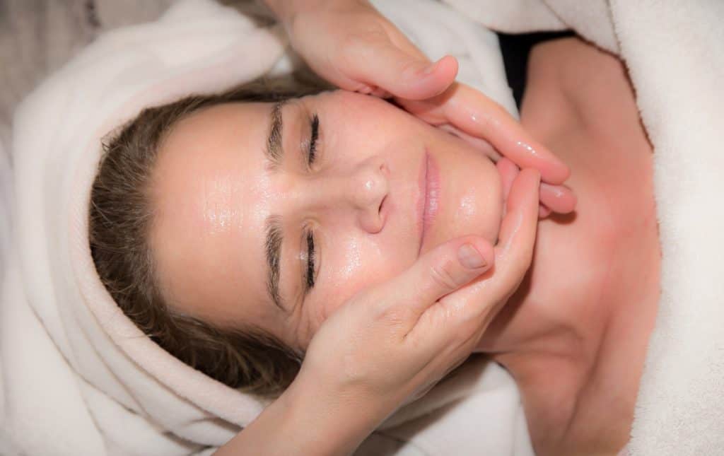 woman receiving a facial massage