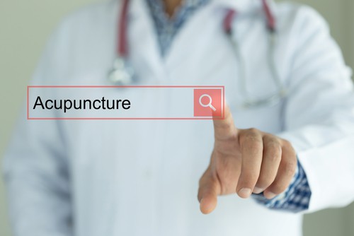 DOCTOR WORKING MODERN INTERFACE TOUCHSCREEN SEARCHING AND ACUPUNCTURE CONCEPT
