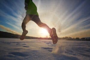 athlete-running-in-snow