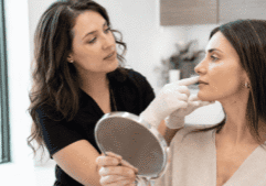 Botox injector Kennesaw GA reviewing facial treatment areas during a personalized aesthetic consultation