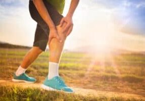 runner-leg-and-muscle-pain-during-running-training-outdoors-in-summer-nature